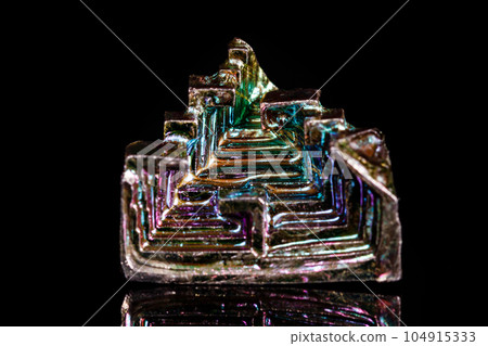Macro mineral stone Bismuth on black background Macro mineral stone Bismuth on black background 104915333