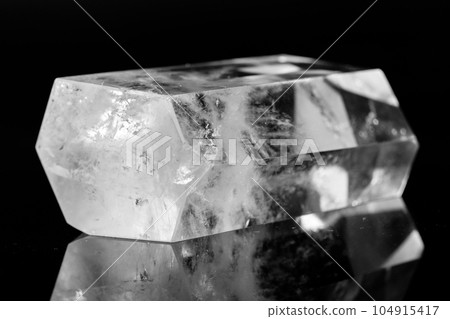 Macro mineral stone Crystal rock crystal on a black background 104915417