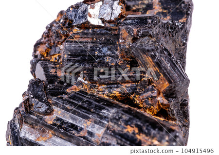 macro mineral stone sherle, schorl, black tourmaline on white background 104915496