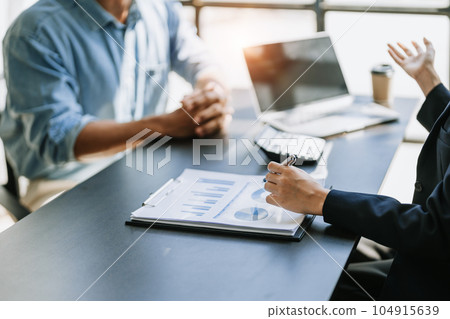 startup business, business advisor leadership for planning finance investment teamwork paperwork audit and discussing marketing, profit, budget of company in meeting room 104915639