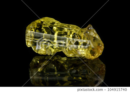 Macro mineral beryl heliodor stone on black background Macro mineral beryl heliodor stone on black background 104915740