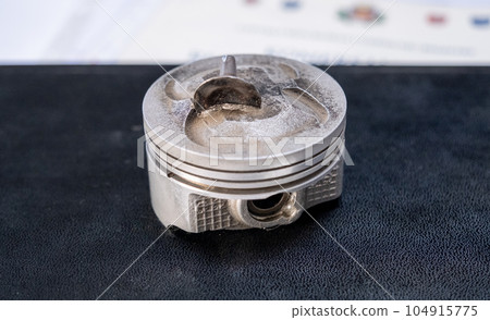 Broken connecting rod and engine piston isolated on white background Broken connecting rod and engine piston isolated on white background 104915775
