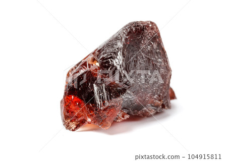 Macro mineral stone Garnet Spessartine on a white background 104915811