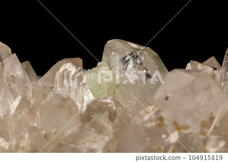 Macro mineral stone Prehnite quartz on a black background Macro mineral stone Prehnite quartz on a black background 104915819
