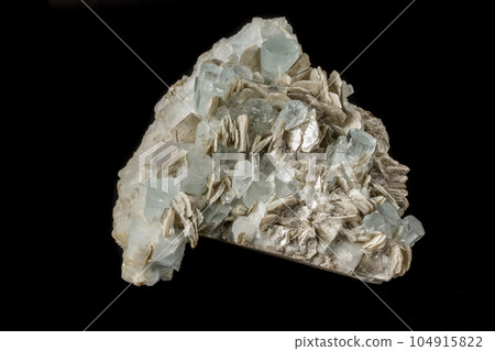 Macro mineral stone Aquamarine in rock on a black background Macro mineral stone Aquamarine in rock on a black background 104915822