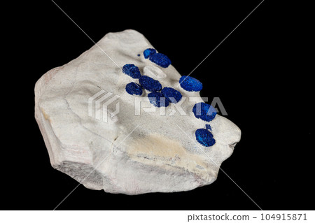 Macro mineral stone Azurite in siltstone against black background 104915871