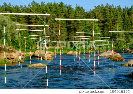 Canoe slalom course gate with paddler background. River Gauja Latvia. City Valmiera 104916395
