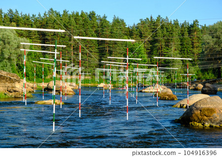 Canoe slalom course gate with paddler background. River Gauja Latvia. City Valmiera 104916396