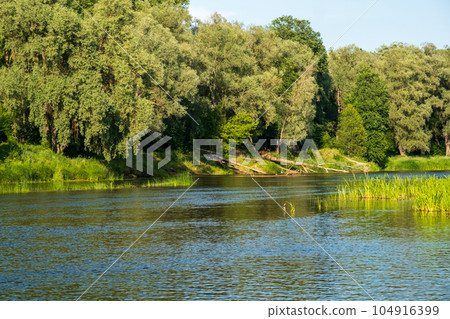 Gauja river in Valmiera. river panorama with beautiful green banks. The longest river in Latvia 104916399