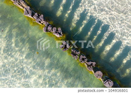 Groynes on the beach at Zingst, Mecklenburg-West Pomerania, Germany Groynes on the beach at Zingst, Mecklenburg-West Pomerania, Germany 104916801