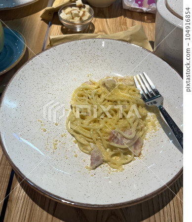 Pasta carbonara with bacon and cream sauce Pasta carbonara with bacon and cream sauce 104916854