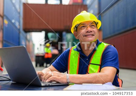 Warehouse engineer worker checking and working at industrial container station Warehouse engineer worker checking and working at industrial container station 104917353