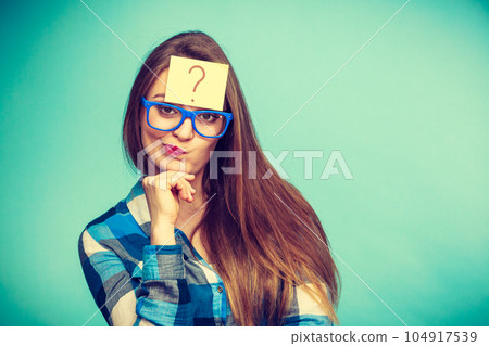 Thinking woman with big eyeglasses and light bulb Thinking woman with big eyeglasses and light bulb 104917539