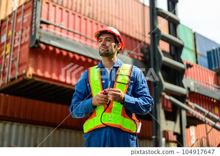 Warehouse engineer worker working at industrial container yard Warehouse engineer worker working at industrial container yard 104917647