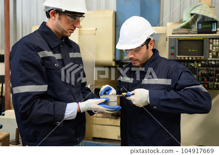 Engineer technician controlling robotic arms on computer laptop Engineer technician controlling robotic arms on computer laptop 104917669