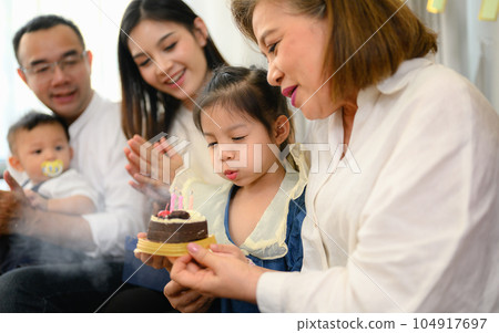 Happy and cheerful family spending good time together at home 104917697