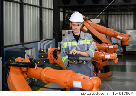 Maintenance engineer worker working with robotic machine automation Maintenance engineer worker working with robotic machine automation 104917907