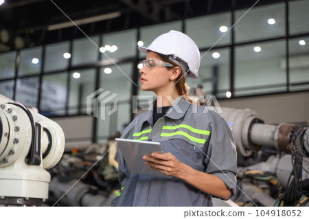 Maintenance engineer worker working with robotic machine automation 104918052