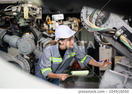 Maintenance engineer worker working with robotic machine automation 104918088