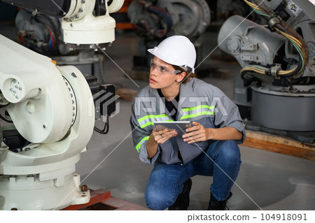Maintenance engineer worker working with robotic machine automation 104918091