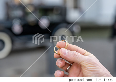In man fingers are two wedding rings Wedding tradition Gold rings 104918330