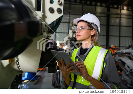 Maintenance engineer worker working with robotic machine automation 104918354