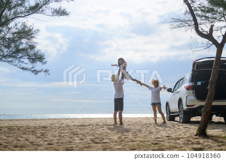 Happy Asian family travel on beach on holiday 104918360