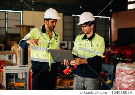 Technician engineer checking and repairing automatic robotic machine 104918659