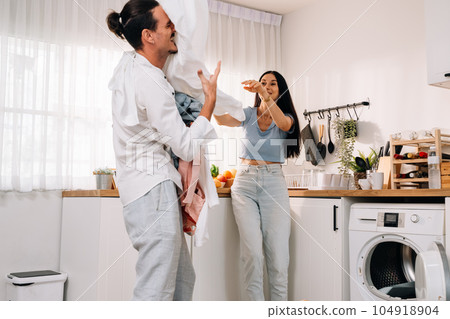 Happy young couple of husband and wife spending time together at home 104918904