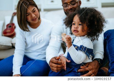 Happy family spending time and having activities together at home 104919157