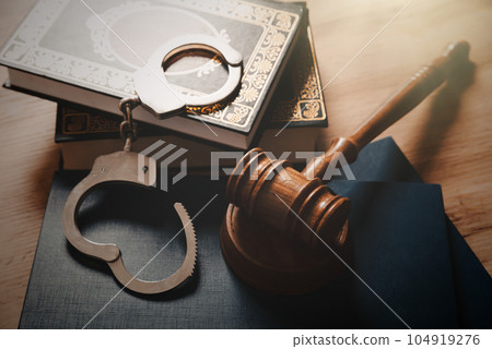 Judge gavel and legal book on wooden table Judge gavel and legal book on wooden table 104919276