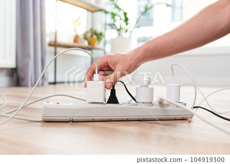 Electrical plug in outlet socket at home 104919300