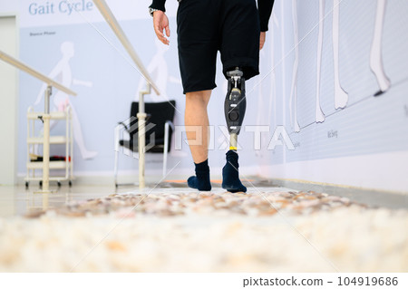 Disabled athlete patient with physical disability doing exercise Disabled athlete patient with physical disability doing exercise 104919686