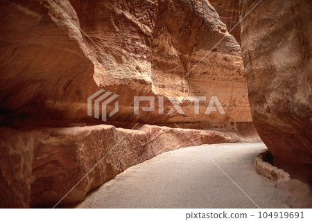 View of the canyon and the high, winding, mountain walls of the canyon. Petra, Jordan 104919691