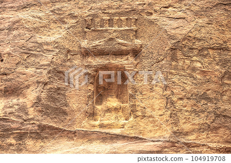 View of a wall with a man-made sandstone window. Petra, Jordan View of a wall with a man-made sandstone window. Petra, Jordan 104919708