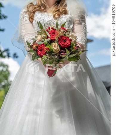 Bride holding Bouquet in female hands. Flowers for the wedding 104919709