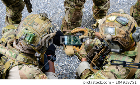 Smart teamwork of soldiers running forward and attacking enemy during military operation, Army soldiers in protective combat uniform, Soldiers with rifle, Soldiers with rifle on world war field 104919751