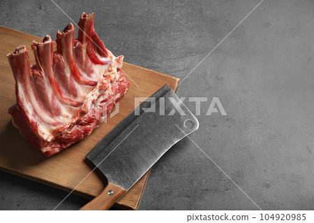 Raw ribs on grey table. Space for text 104920985