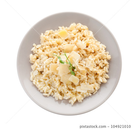 Delicious risotto with cheese isolated on white, top view Delicious risotto with cheese isolated on white, top view 104921010