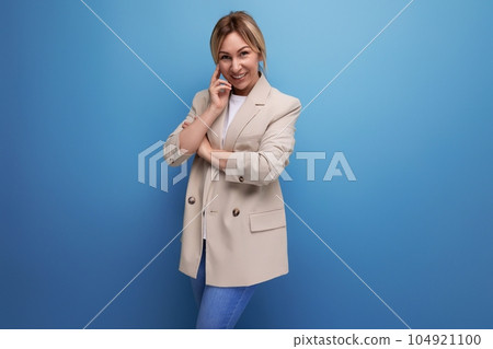 portrait of positive smiling business woman in jacket in studio with copy space portrait of positive smiling business woman in jacket in studio with copy space 104921100