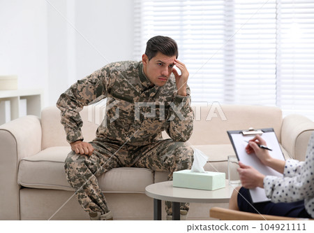 Psychotherapist working with male military officer in office Psychotherapist working with male military officer in office 104921111