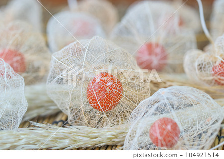 Lots of watermark Physalis on the blinds. Served with dry flowers of wheat and pampas grass. Lots of watermark Physalis on the blinds. Served with dry flowers of wheat and pampas grass. 104921514