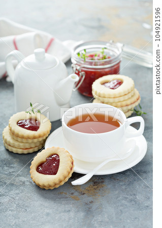 Linzer cookies with jam filling Linzer cookies with jam filling 104921596
