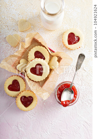 Heart shaped vanilla cookies with jam filling 104921624