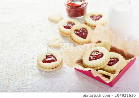Heart shaped vanilla cookies with jam filling 104921630
