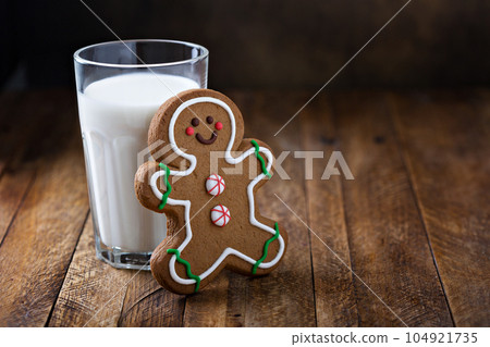 Gingerbread man cookie with a glass of milk Gingerbread man cookie with a glass of milk 104921735