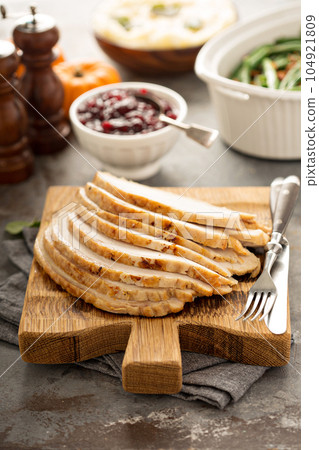 Sliced turkey on Thanksgiving or Christmas table Sliced turkey on Thanksgiving or Christmas table 104921809
