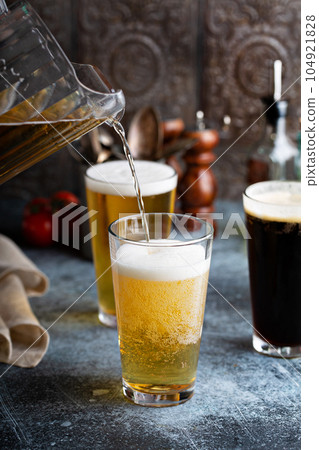 Assortment of beer in tall glasses 104921828