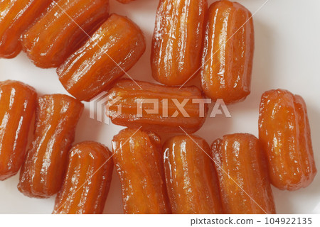 Traditional Turkish dessert tulumba on a plate Traditional Turkish dessert tulumba on a plate 104922135
