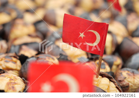 turkish flag on traditional Istanbul street food grilled chestnuts in a row turkish flag on traditional Istanbul street food grilled chestnuts in a row 104922161